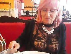 Sexy mature woman in a see thru top