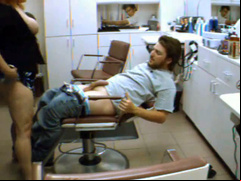 Busty woman penetrated by her man in the salon chair