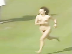 Female streaker runs across the stadium