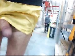 Flashing cock in nylon shorts at the hardware store