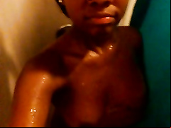 Black babe films herself naked in the shower